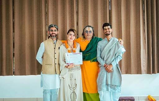 Carla Lerín, student of Nirvana Yoga School Rishikesh receiving her 200-Hour Kundalini YTTC certificate	